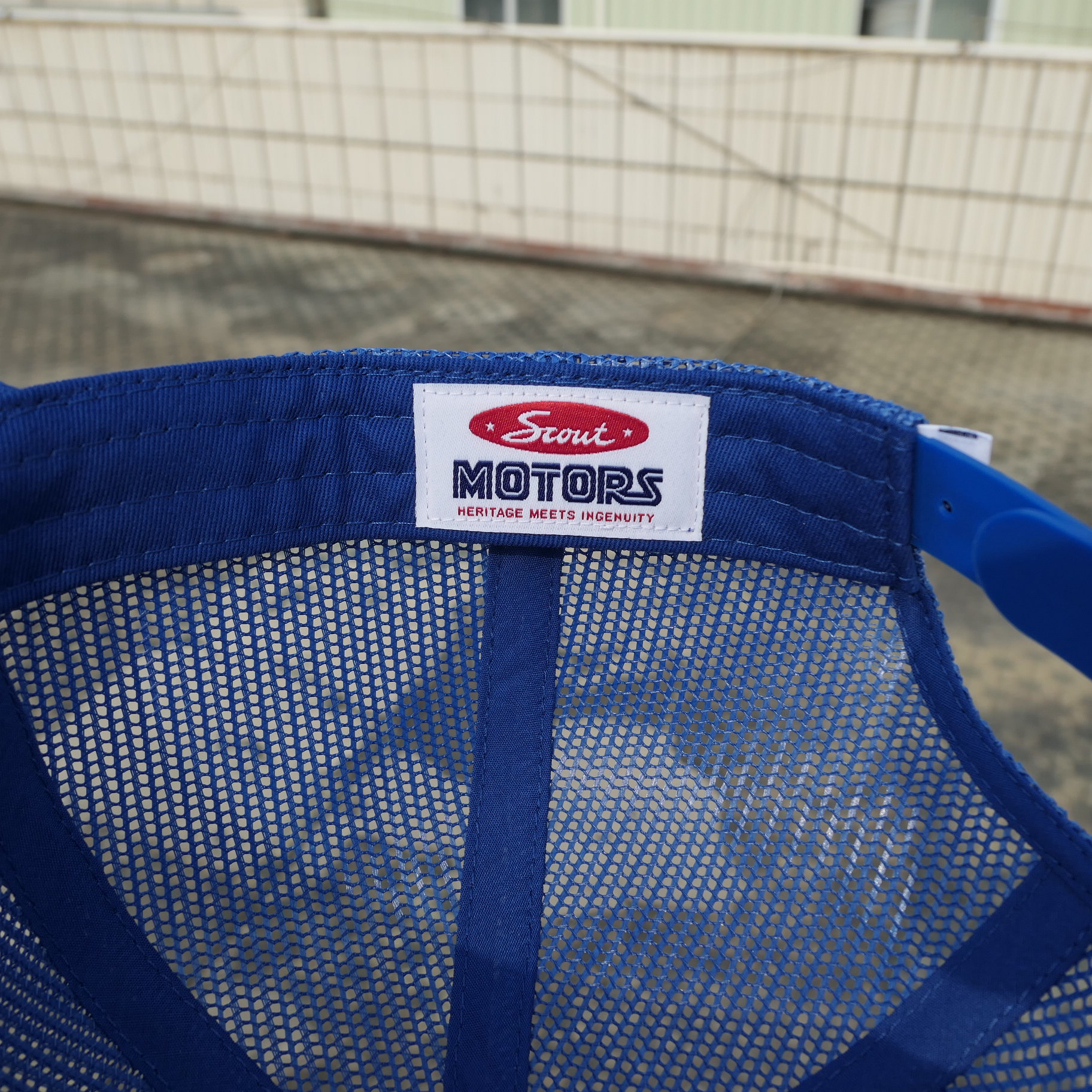 Scout Motors woven label inside the blue mesh cap