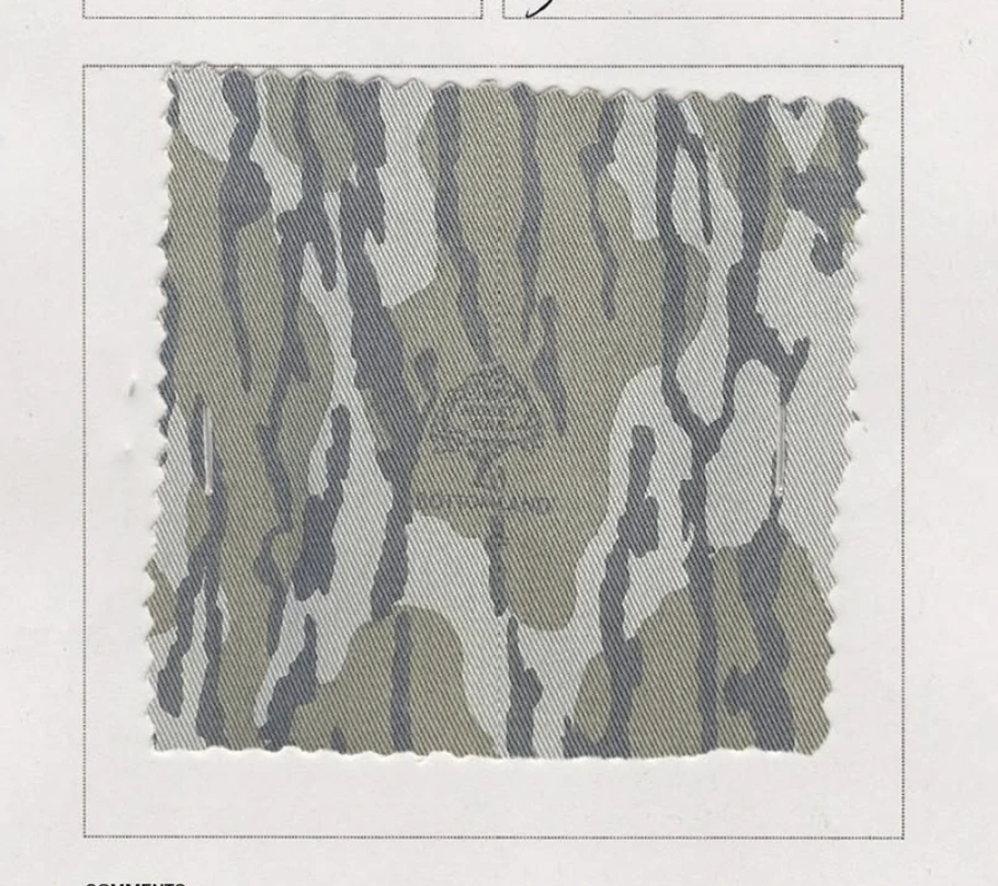 Mossy Oak Bottomland camo fabric swatch with its cut edges visible