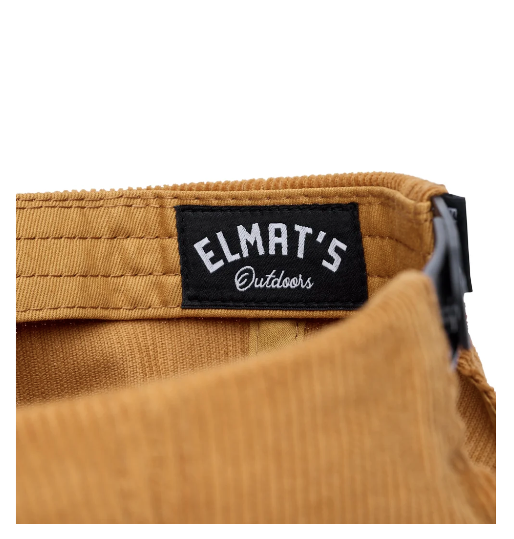 Black Elmat’s Outdoors woven label sewn inside a golden corduroy cap