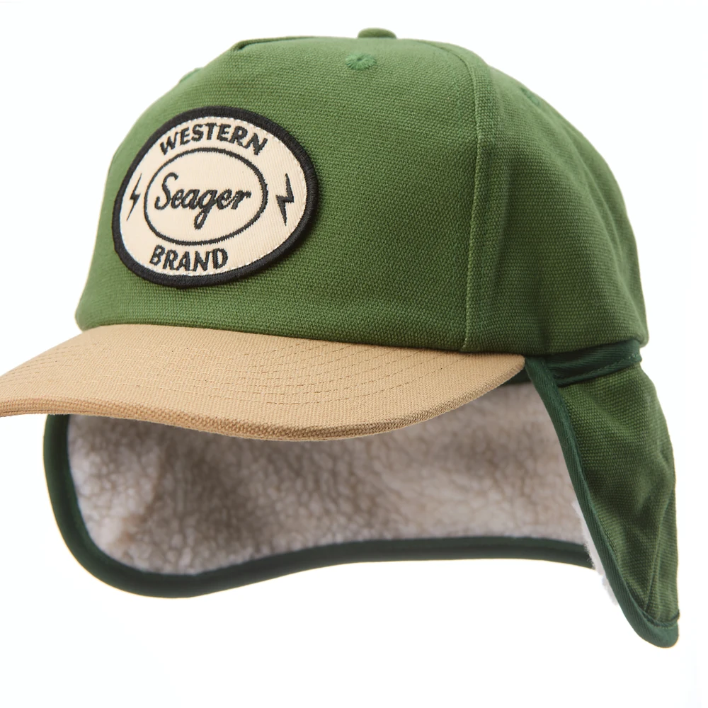 Green and tan Seager flapjack with the fleece-lined earflaps lowered